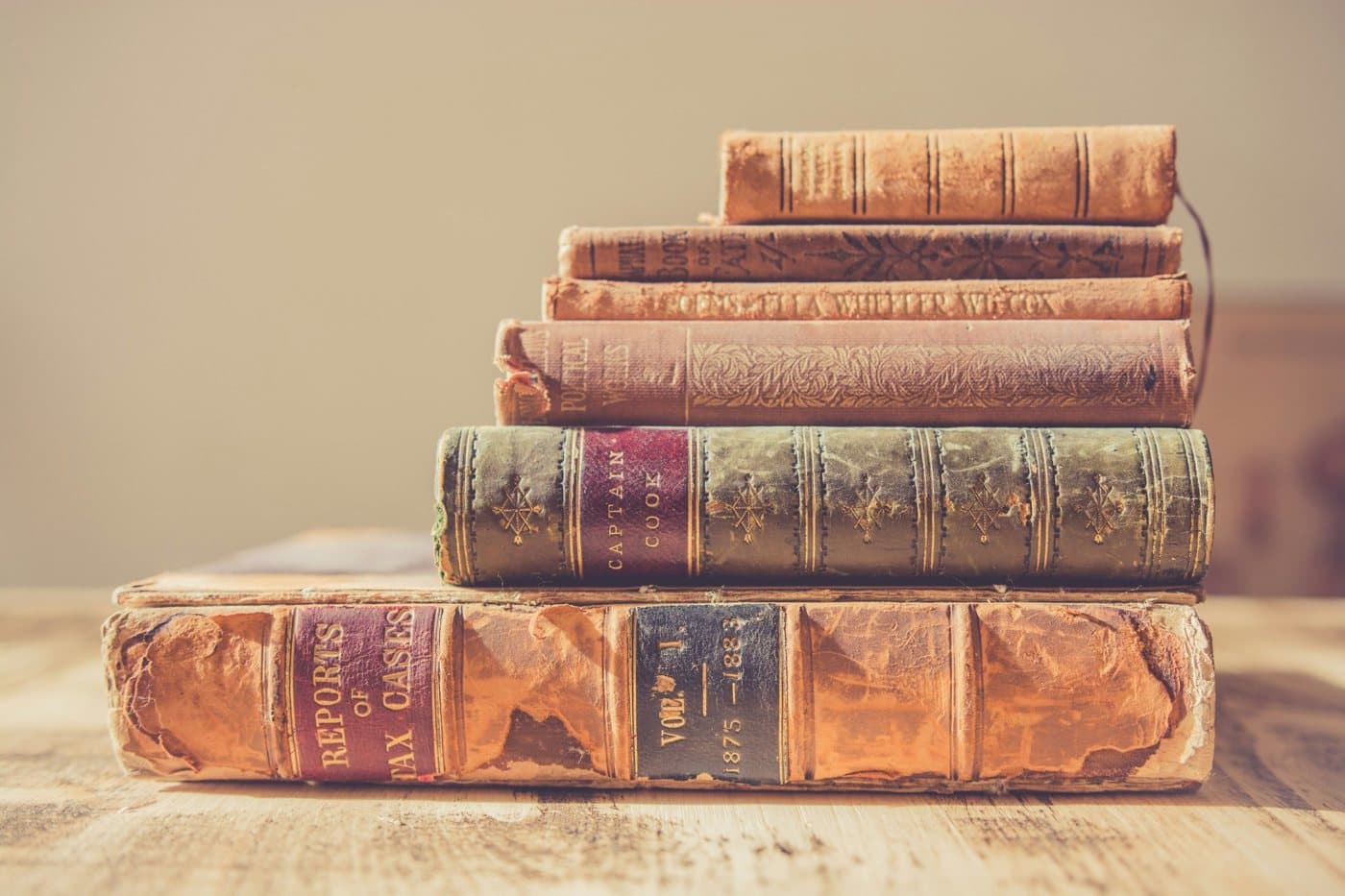 Clarity — clear options, requirements and timelines Stack of antique books on a wooden table