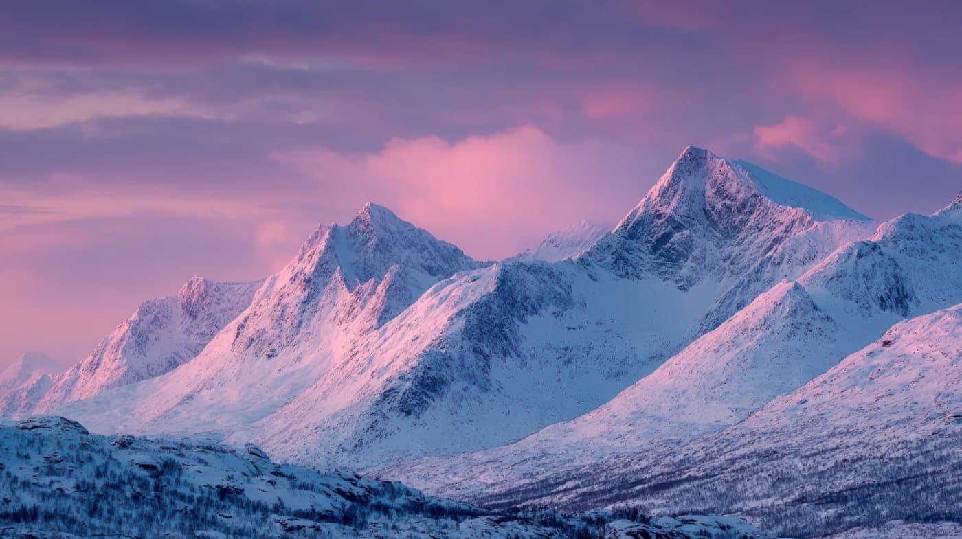 Realistic guidance — honest expectations about study abroad Snow-covered mountain peaks at a pink dusk